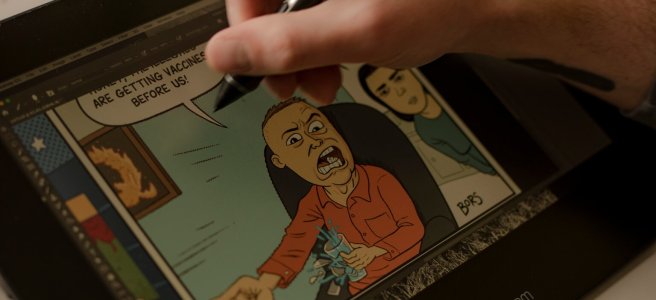 A political cartoon about vaccines is being drawn on a tablet.