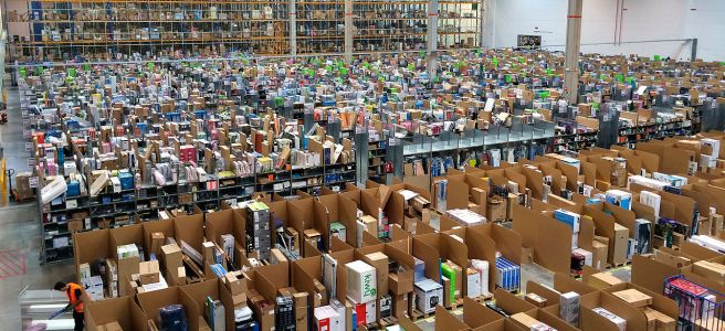 A large warehouse filled with hundreds of boxes organized into different shelves and cubicles.
