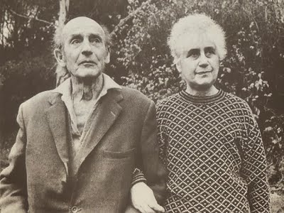 A black and white photo of an older couple.