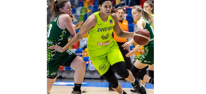 A basketball player dressed in the lime green professional Czech team uniform dribbles a ball around a defender in a dark green jersey.